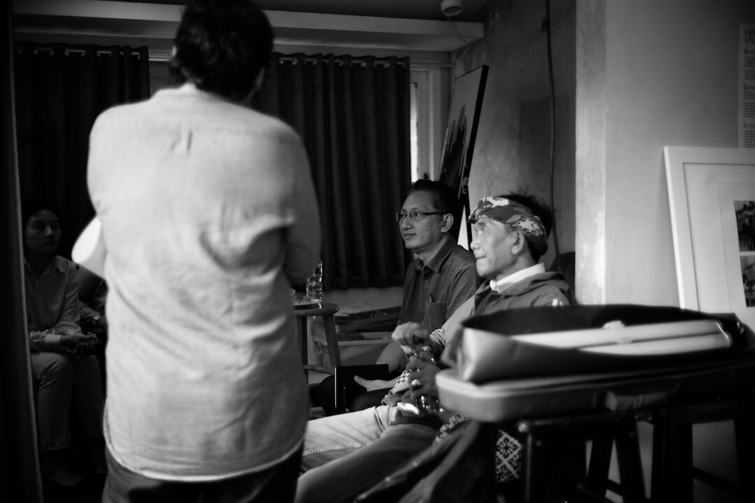 Documentary photography team on location interviewing a resident