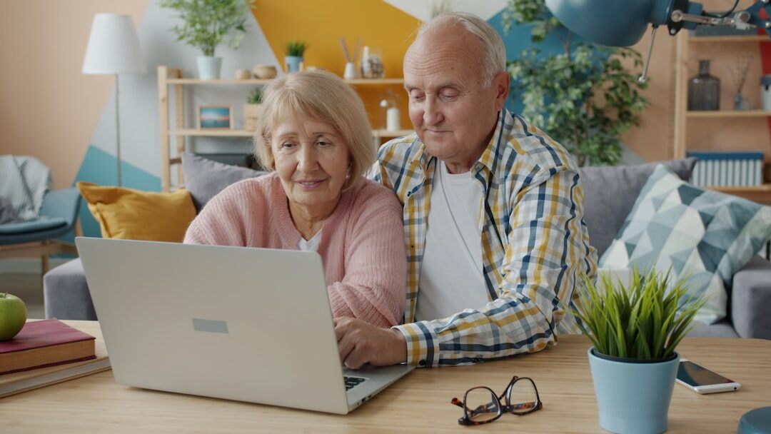 Documentary photo of an elderly Danish couple sitting together at home