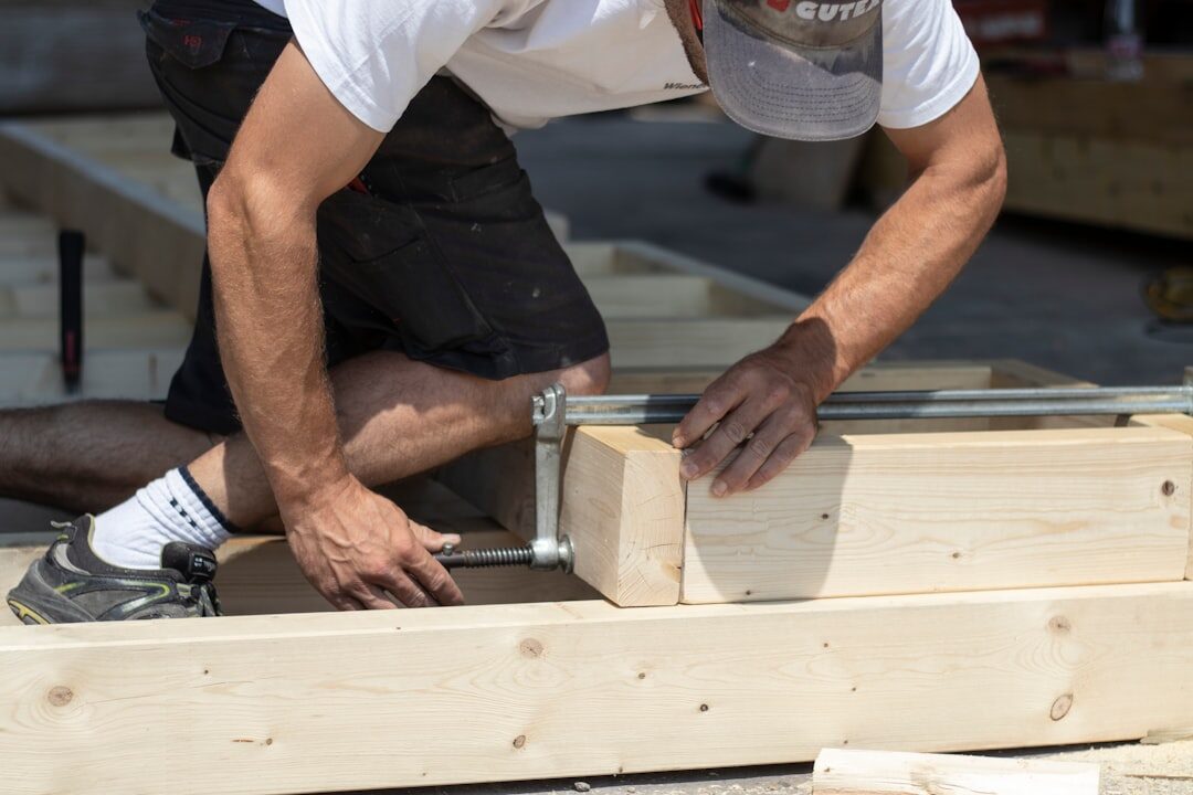 Portrait of a Danish carpenter working with wood in his workshop