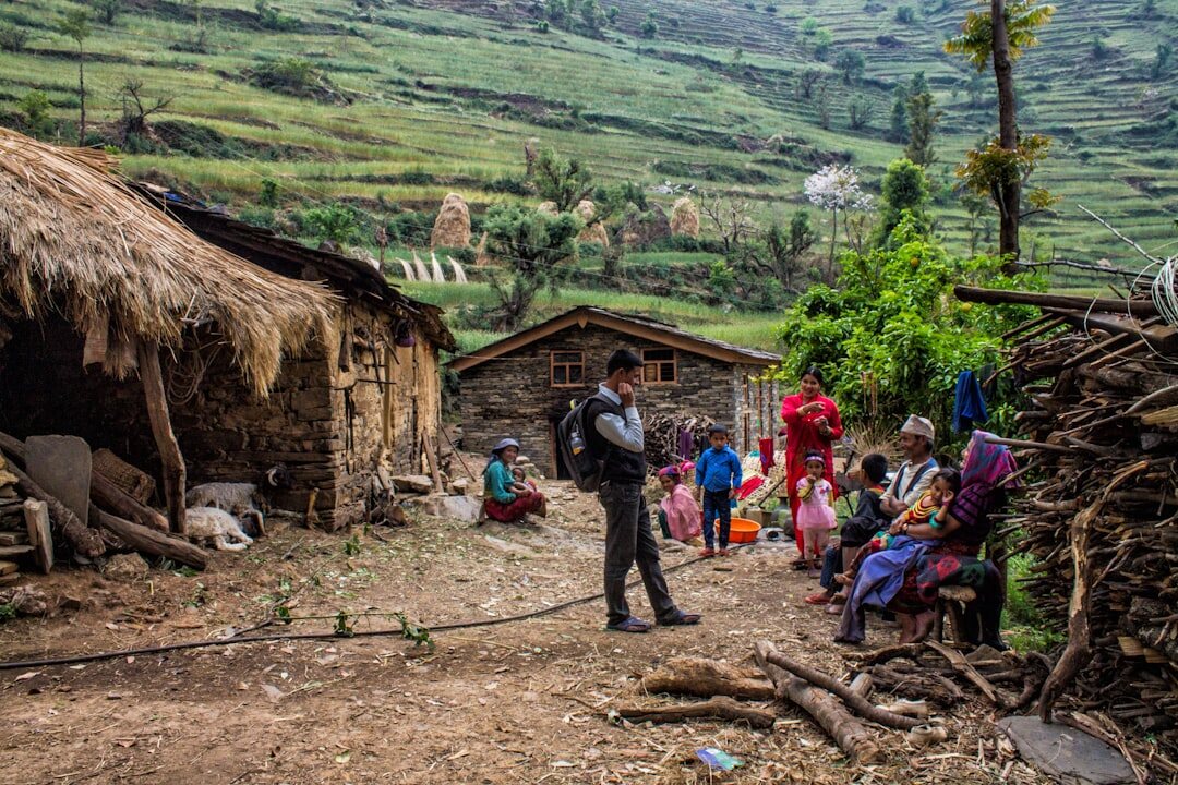 photographer with camera in village
