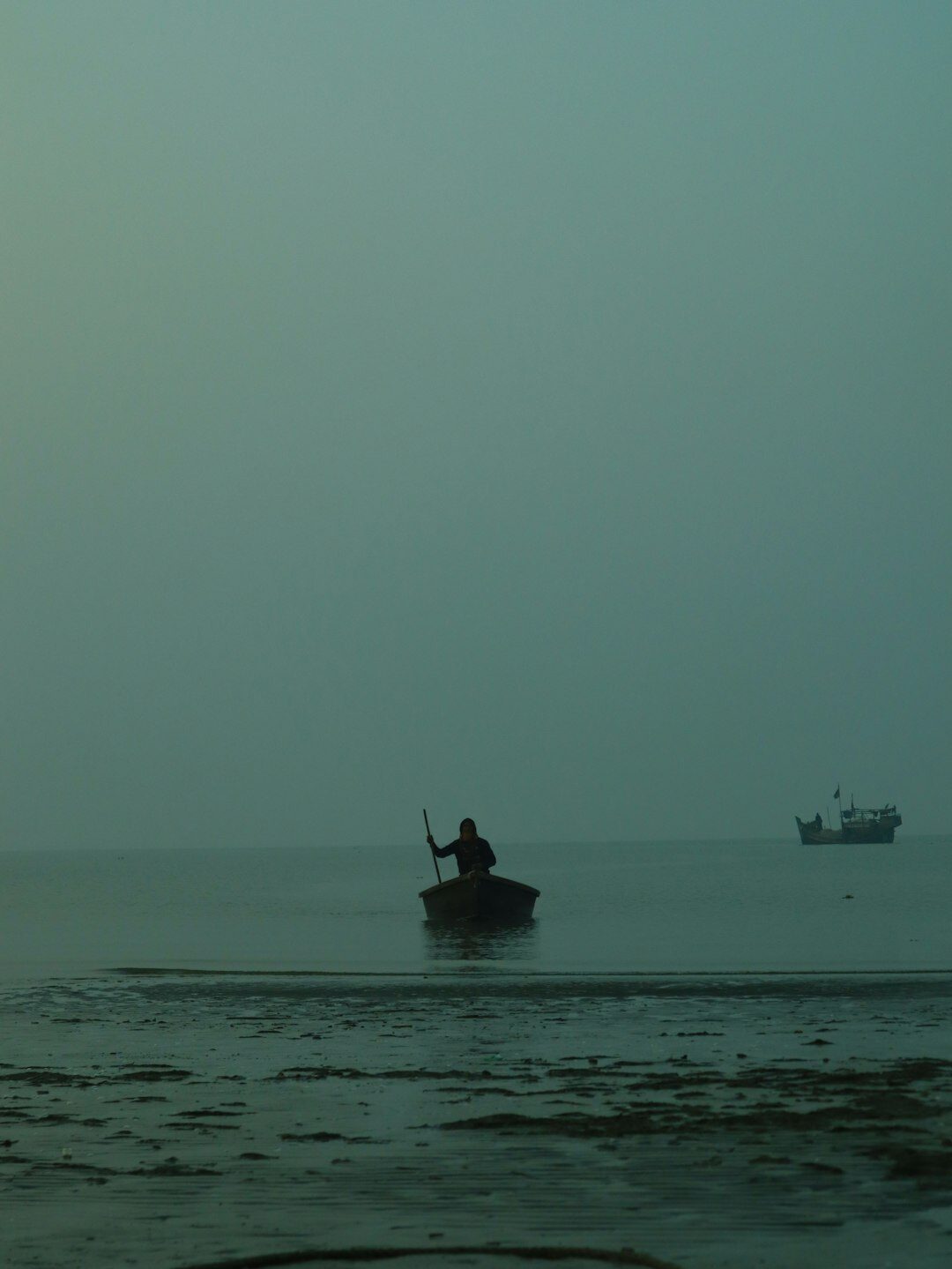 fisherman on boat at dawn